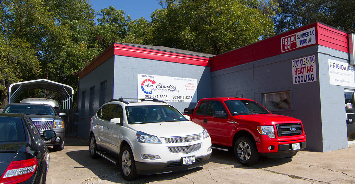 The Air Chandler shop on Jones Street, with a red pickup and a white SUV out front